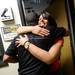 Michigan alum an sports anchor Dana Jacobson hugs former Michigan football player and current EMU football running backs coach Mike Hart during the Mott Takeover at 1050 WTKA on Friday, May 17, 2013. Melanie Maxwell I AnnArbor.com